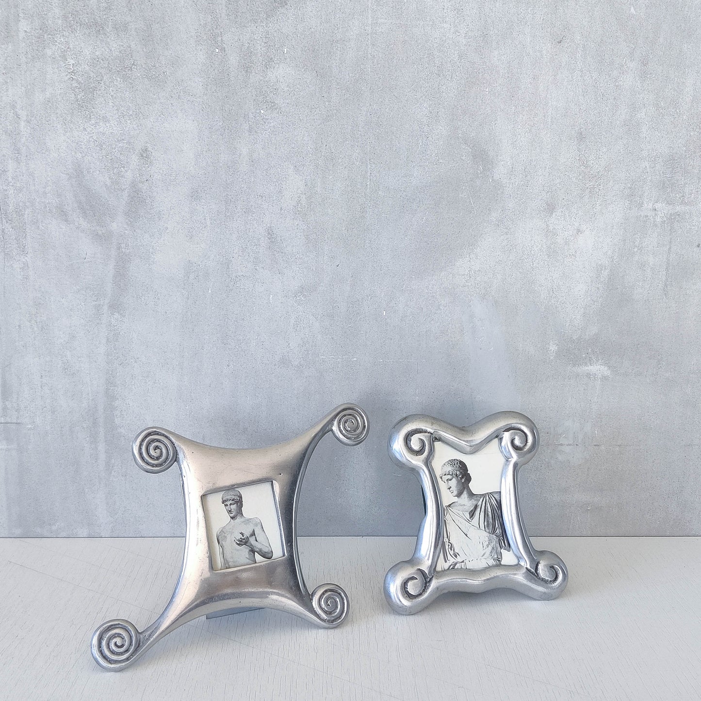 A 1990s cast aluminium chunky frame with inscribed spirals
