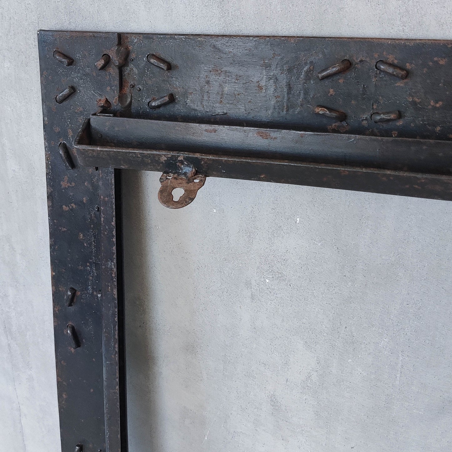 Handmade metalwork welded steel frame with laced cross details