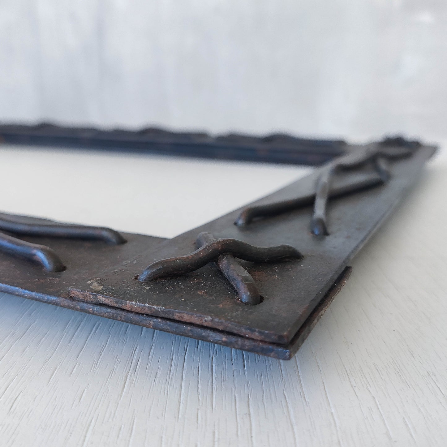 Handmade metalwork welded steel frame with laced cross details