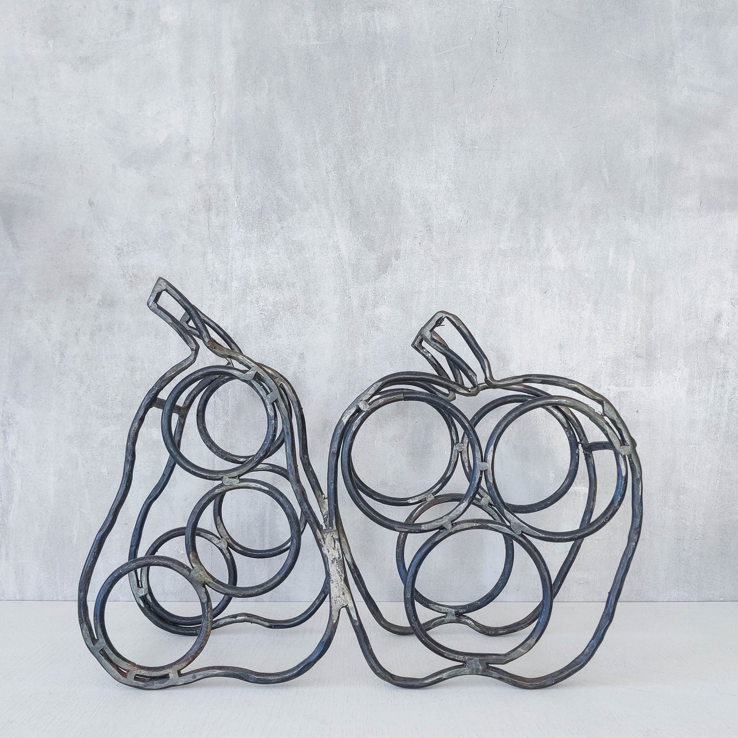 Sculptural metalwork welded steel apple and pear bottle holder