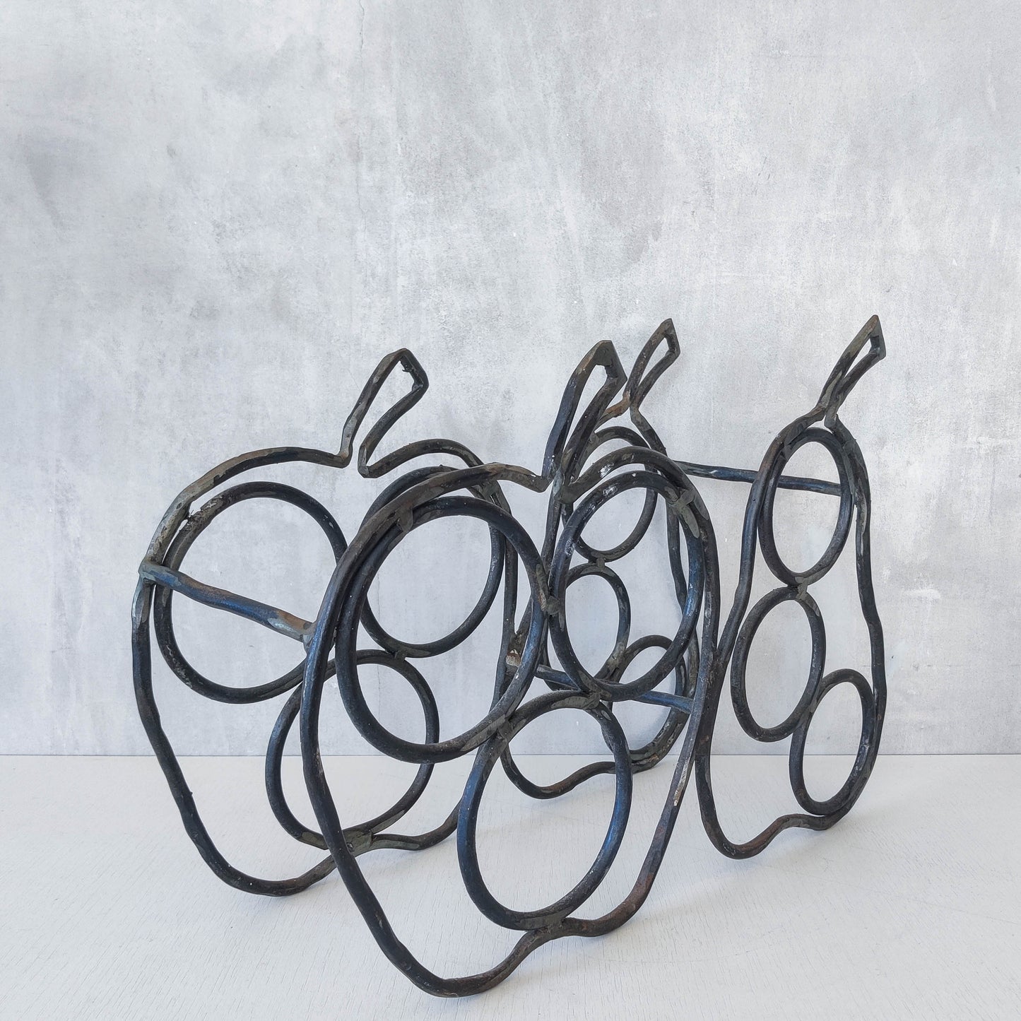 Sculptural metalwork welded steel apple and pear bottle holder