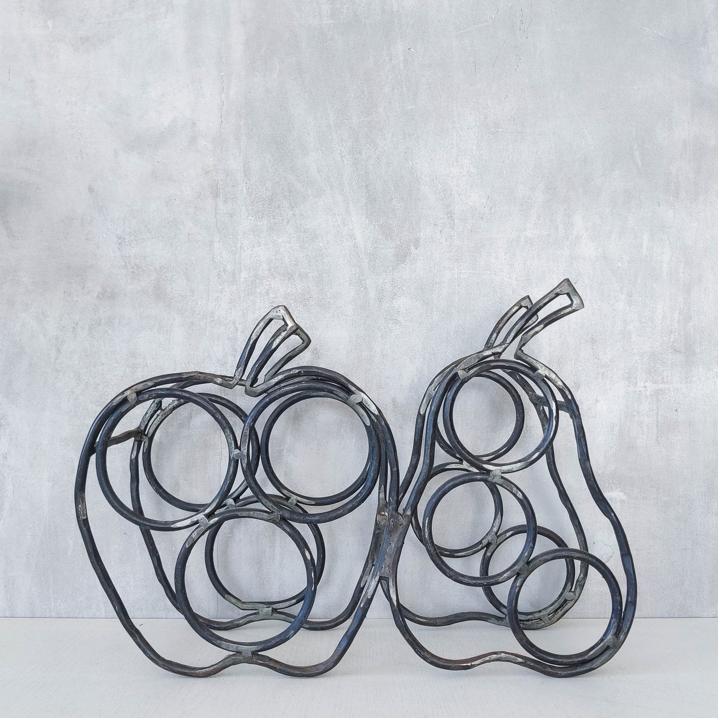 Sculptural metalwork welded steel apple and pear bottle holder