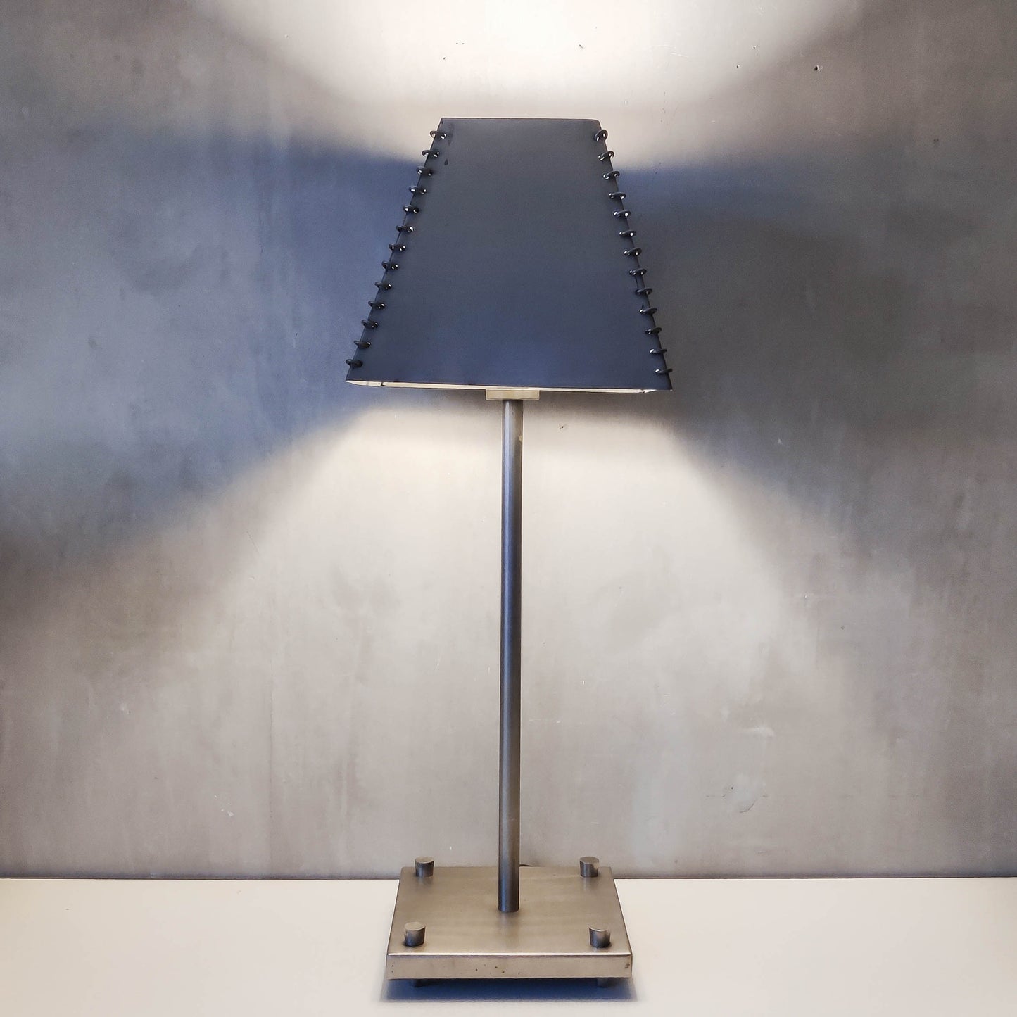 A pair of tall early 1990s Habitat 'Ashrafi' sculptural steel lamps