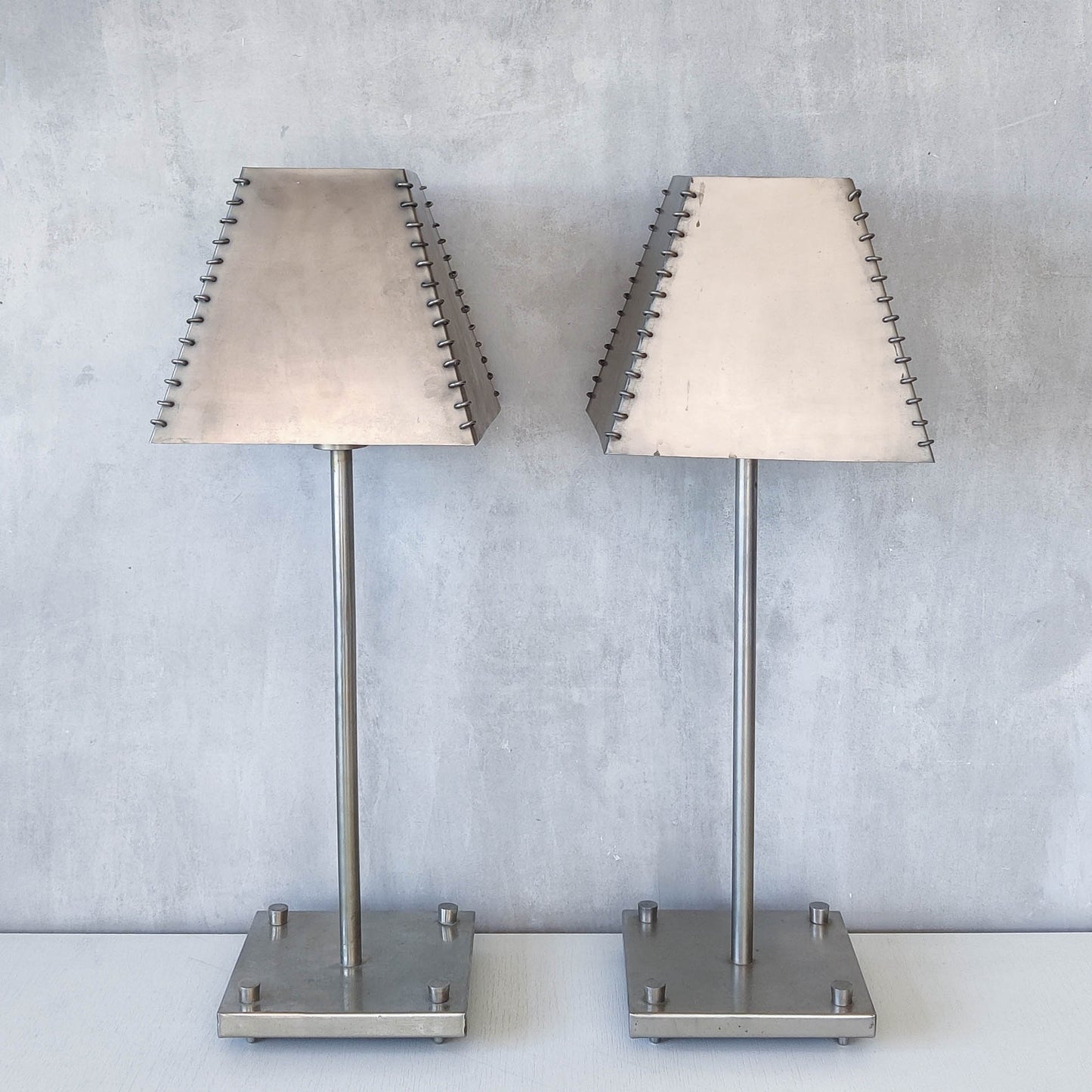 A pair of tall early 1990s Habitat 'Ashrafi' sculptural steel lamps