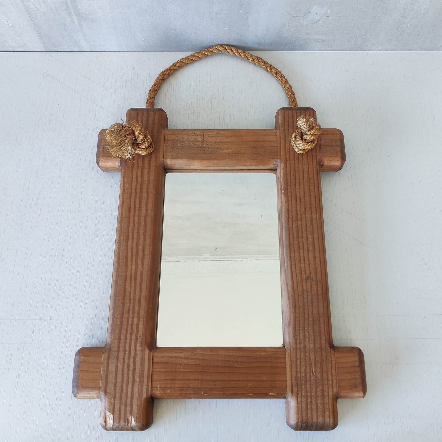 A vintage chunky pine cross corner Oxford frame mirror with knotted rope