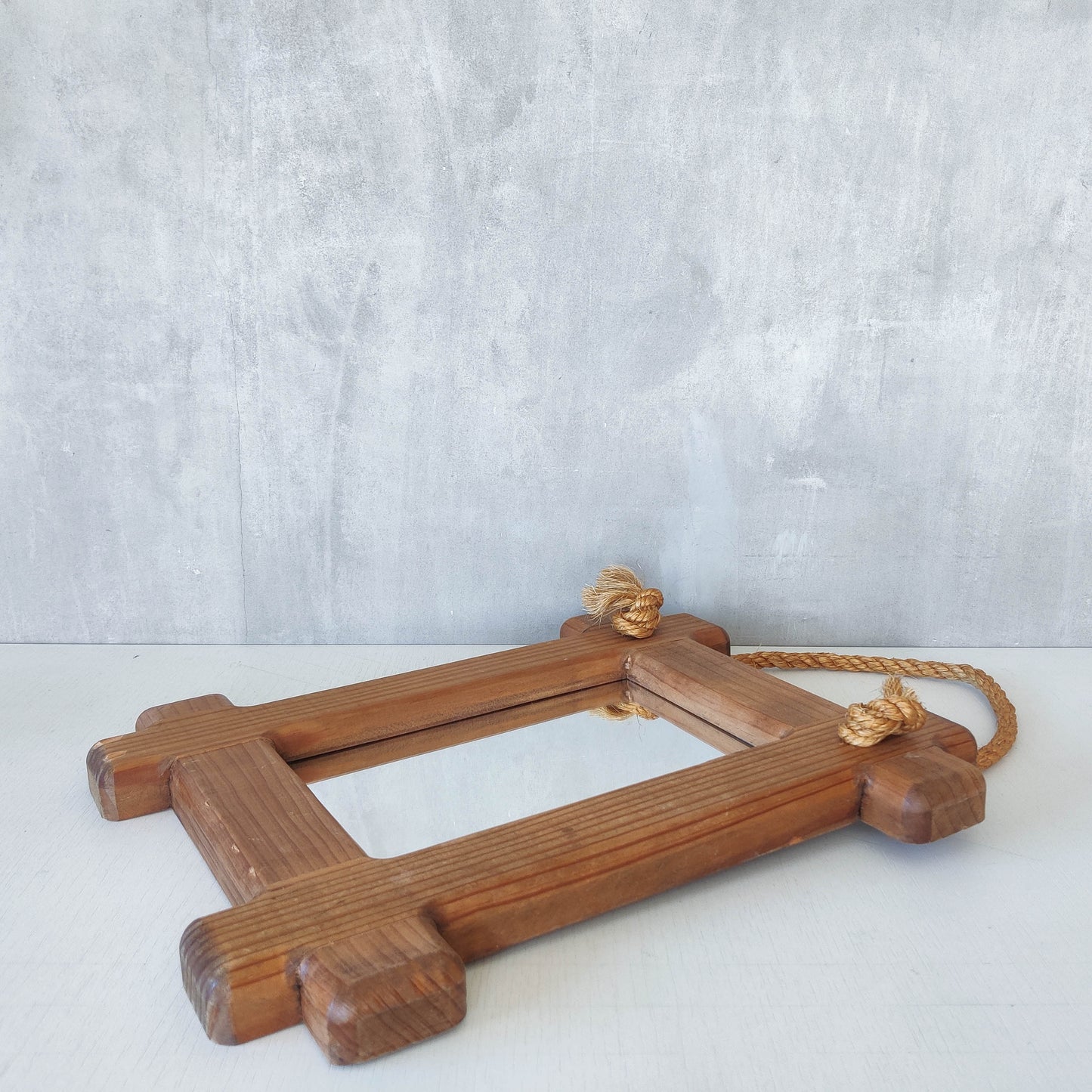 A vintage chunky pine cross corner Oxford frame mirror with knotted rope