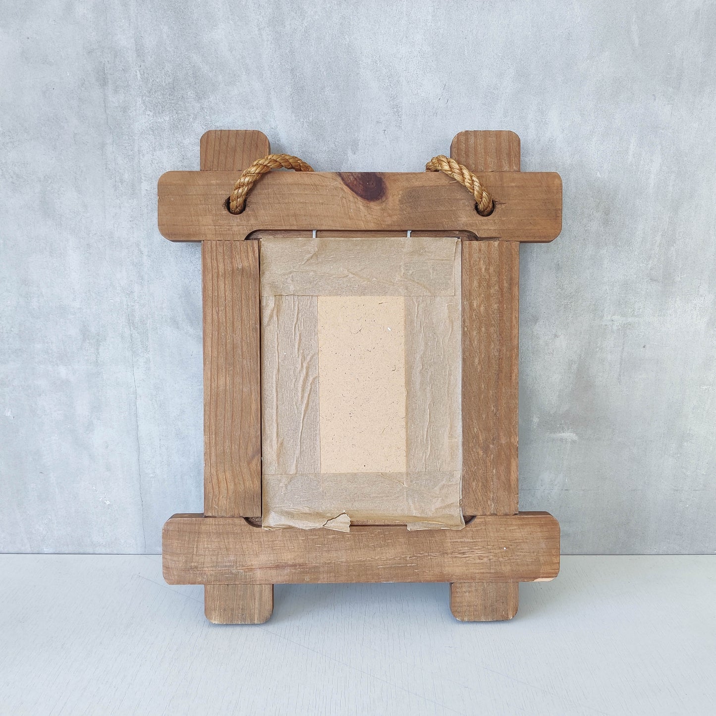 A vintage chunky pine cross corner Oxford frame mirror with knotted rope