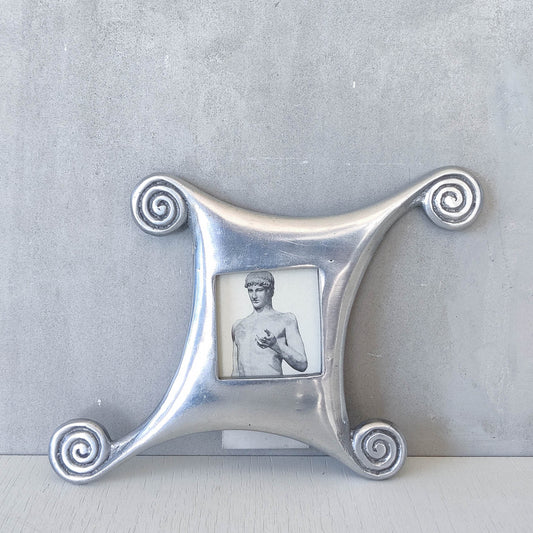 A 1990s cast aluminium photo frame postmodern style with spirals