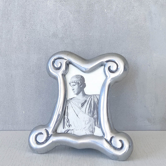 A 1990s cast aluminium chunky frame with inscribed spirals