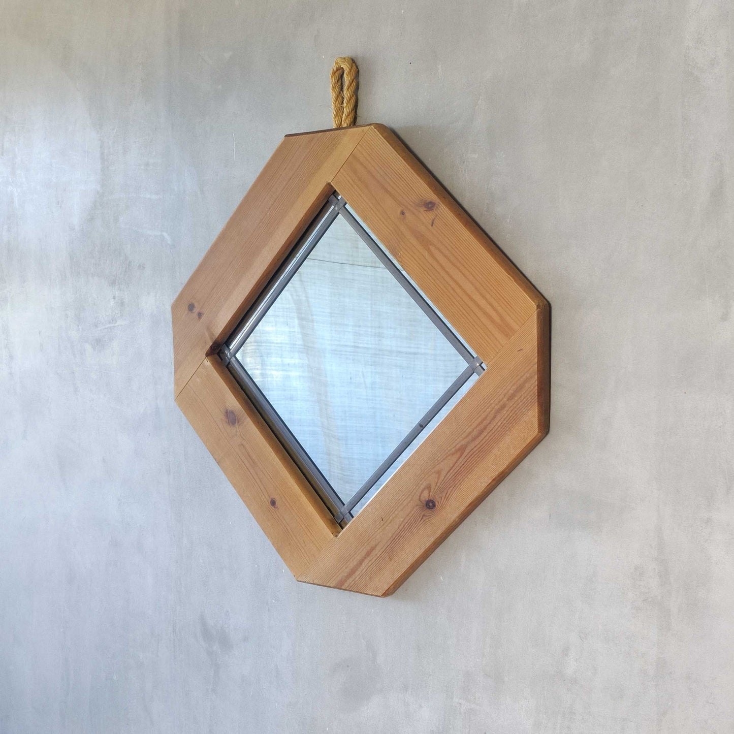 A 1990s pine framed leaded mirror with rope loop