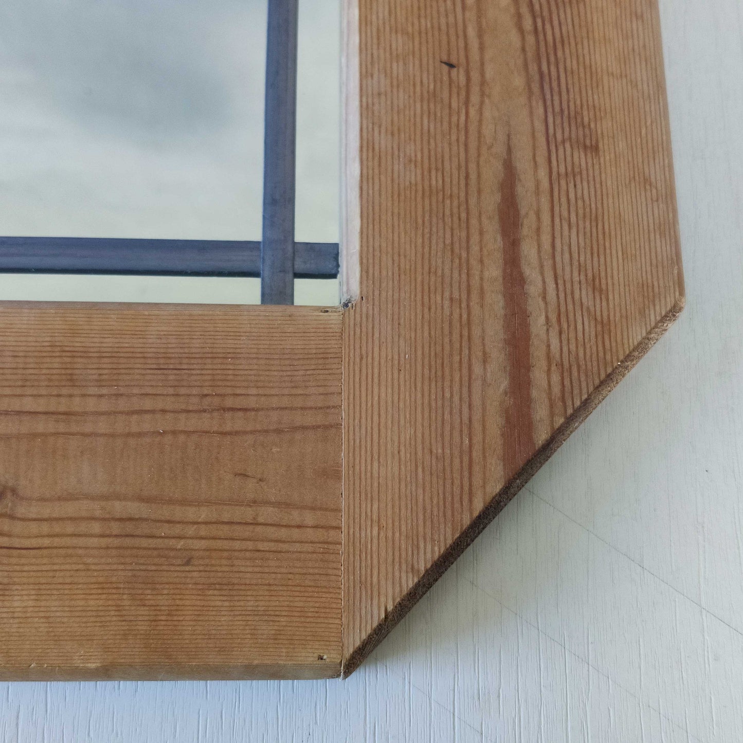 A 1990s pine framed leaded mirror with rope loop