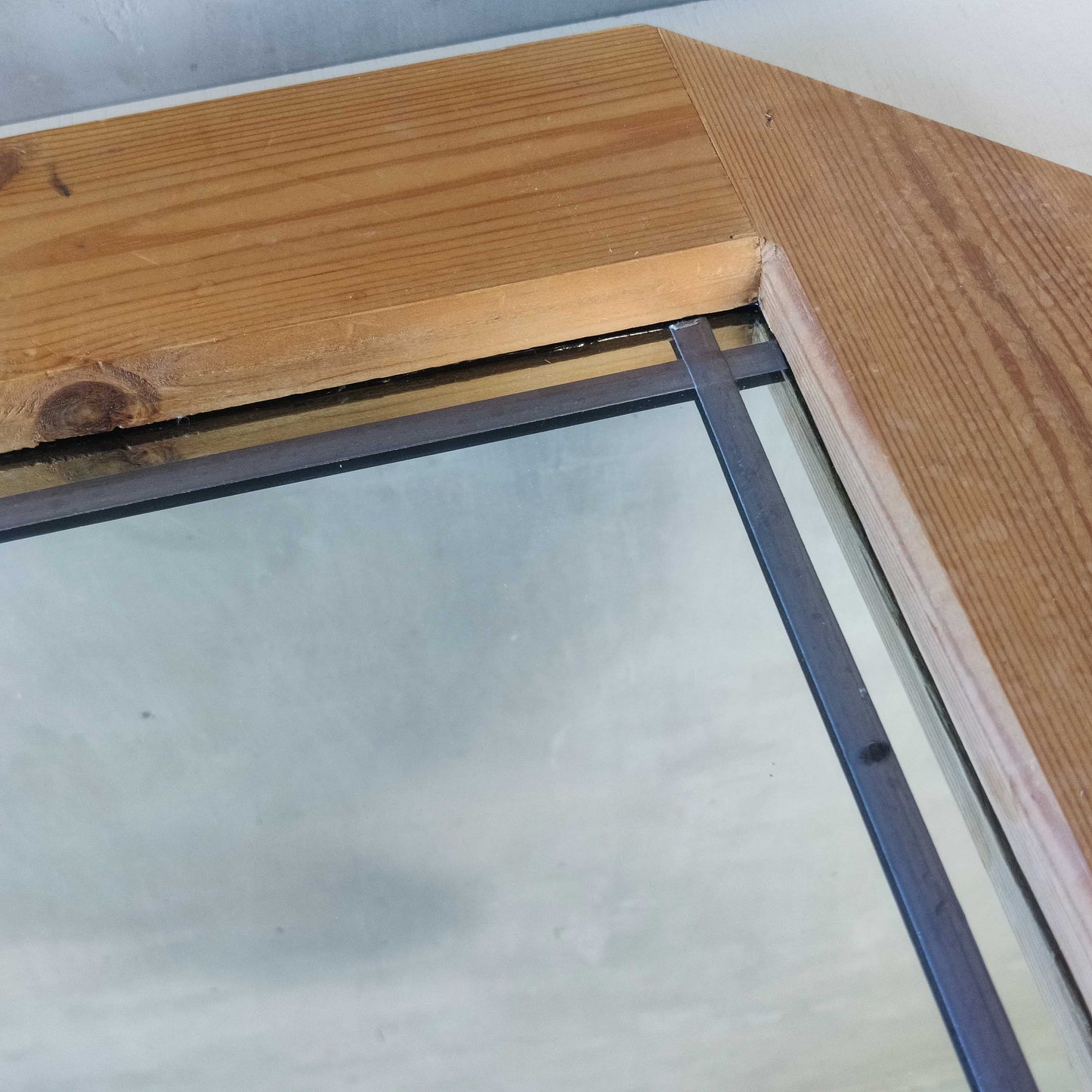 A 1990s pine framed leaded mirror with rope loop