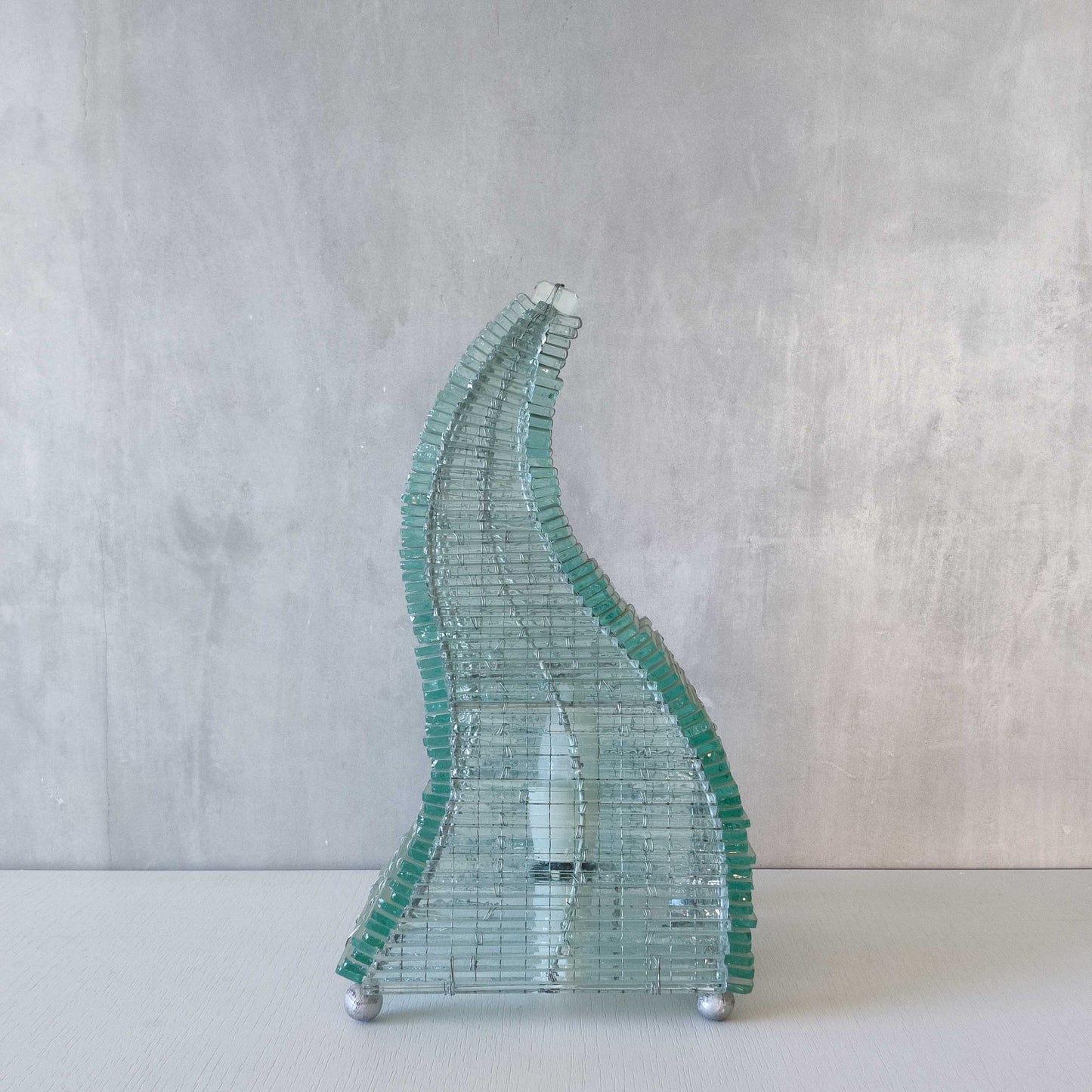 A 1970s stacked glass shard sculptural twisted pyramid lamp
