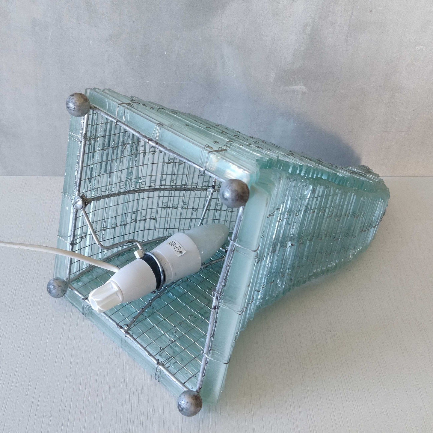 A 1970s stacked glass shard sculptural twisted pyramid lamp