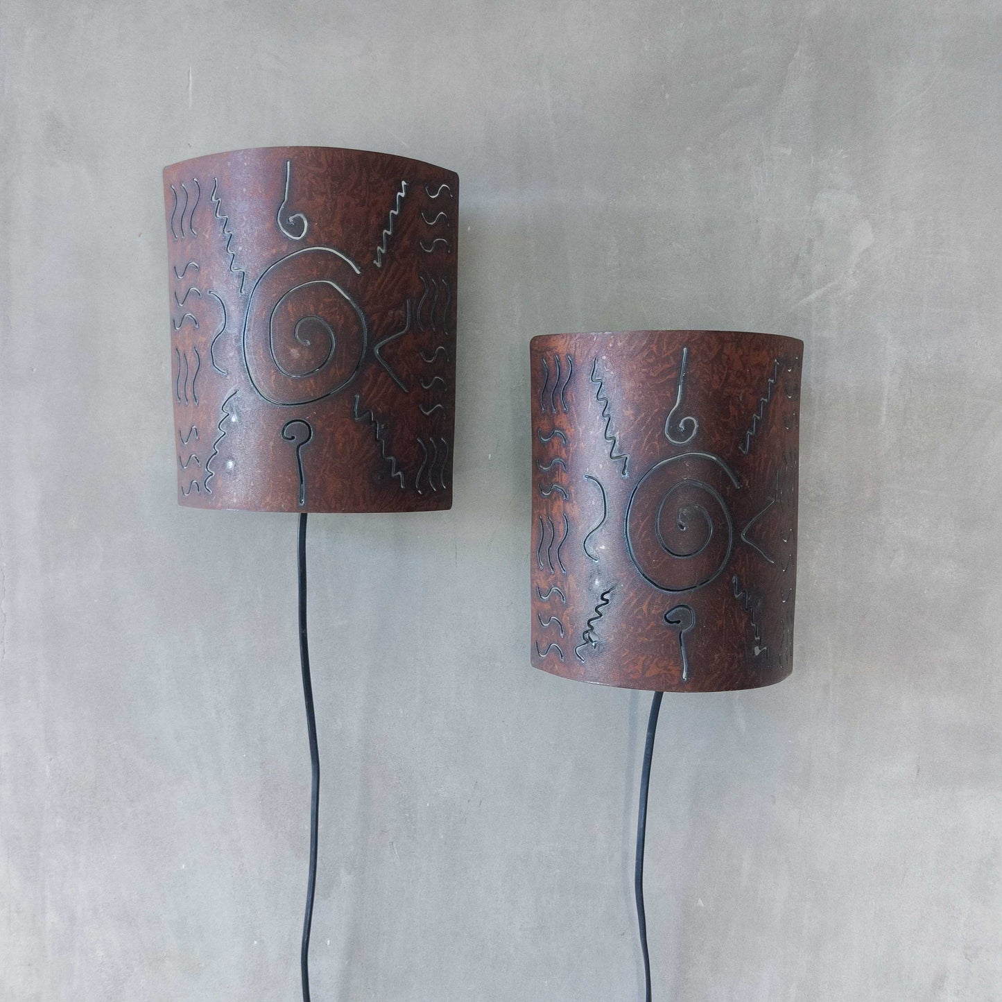 A pair of vintage torch cut steel abstract wall lights sconces