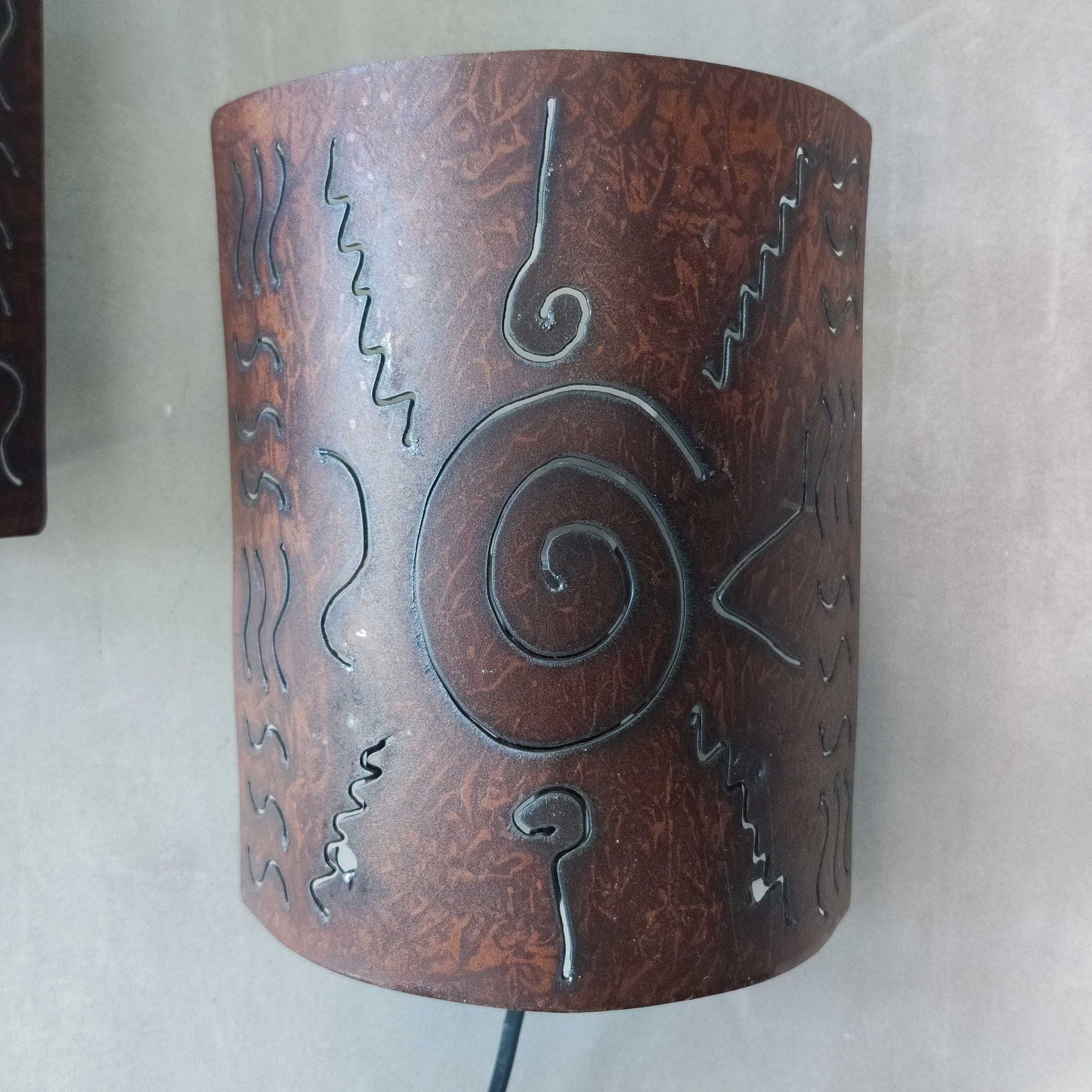 A pair of vintage torch cut steel abstract wall lights sconces