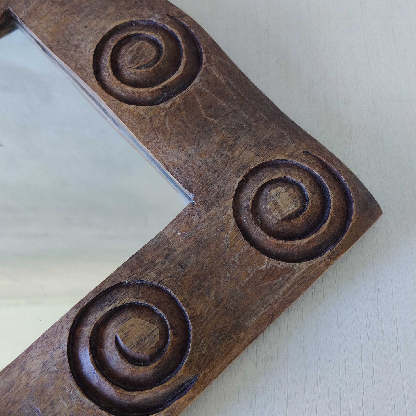 A vintage chunky solid hand carved hardwood wood spiral swirl sculptural mirror