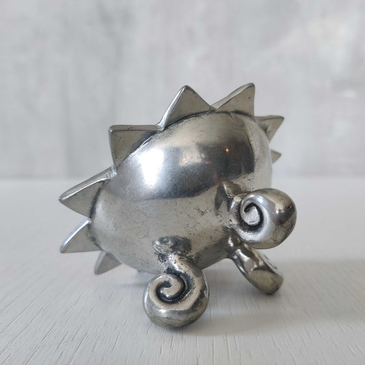 A small early 1990s cast pewter catchall bowl with scrollwork feet
