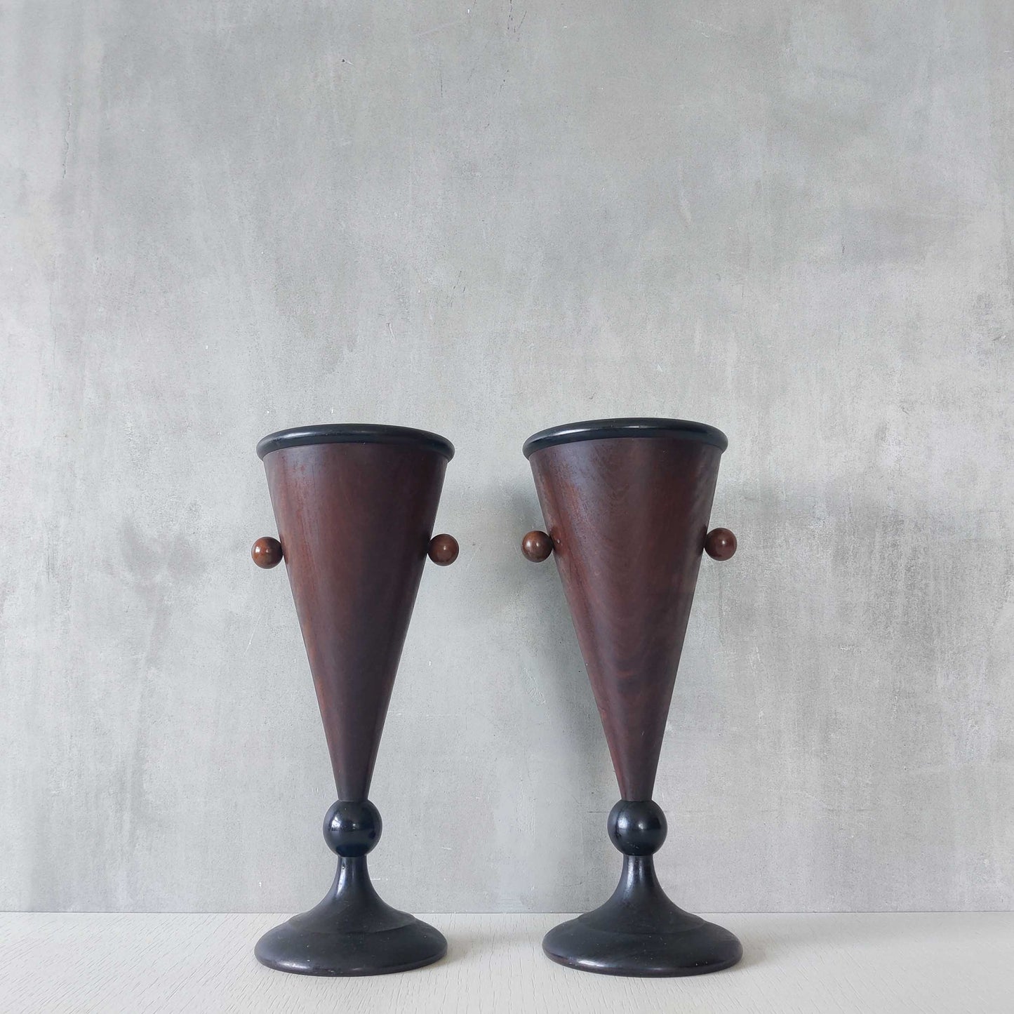 A pair of rosewood vases