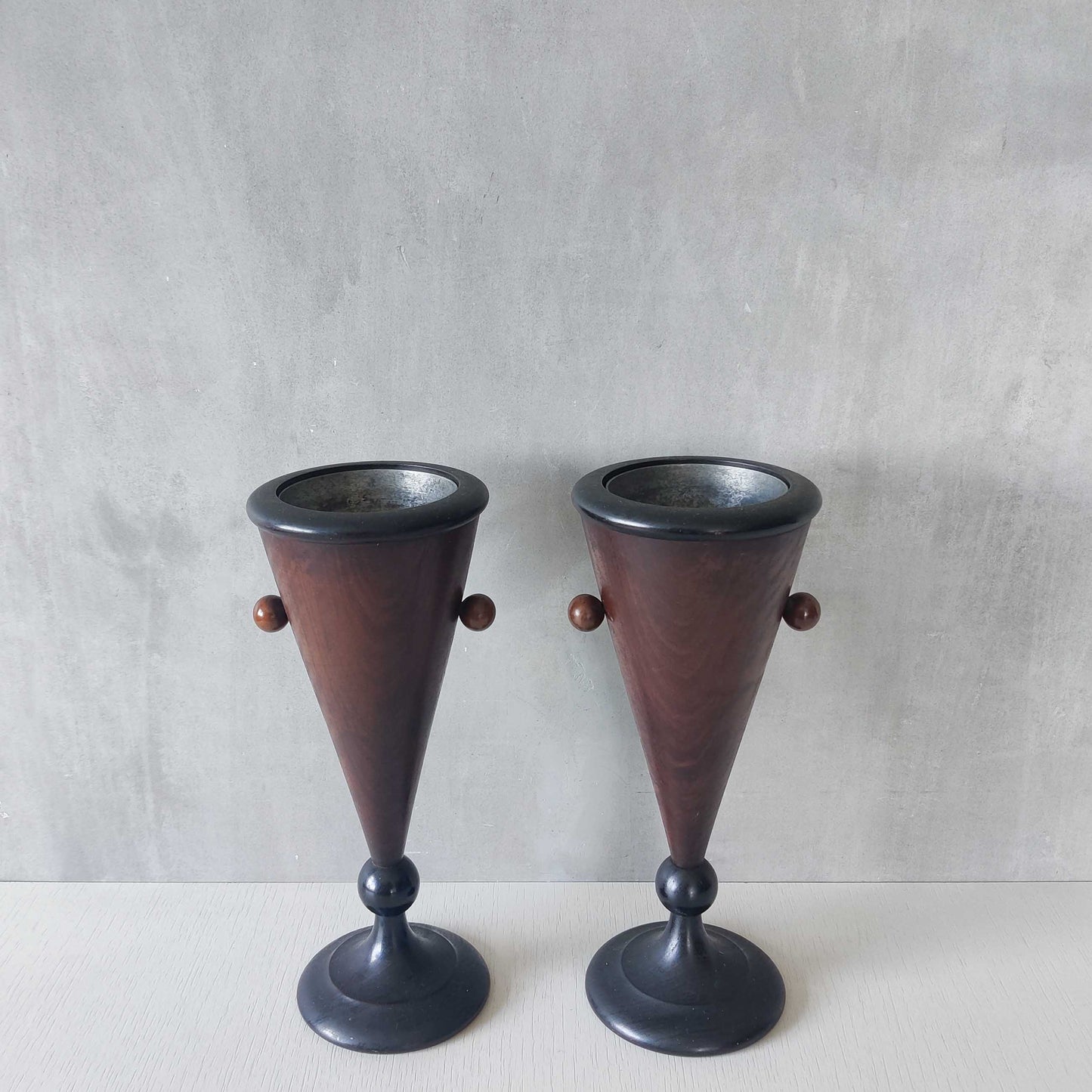 A pair of rosewood vases