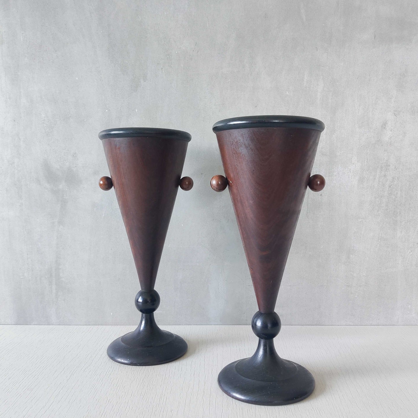 A pair of rosewood vases