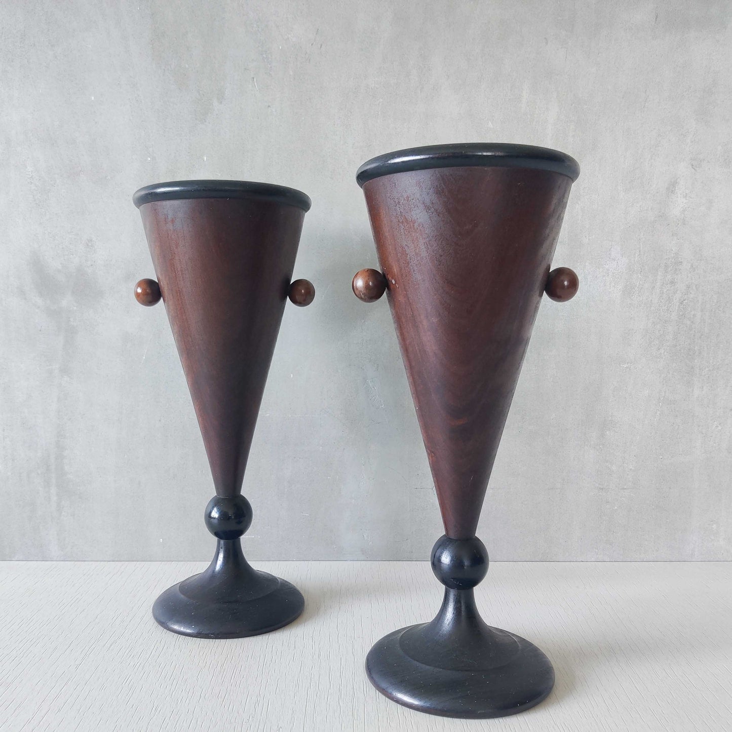 A pair of rosewood vases
