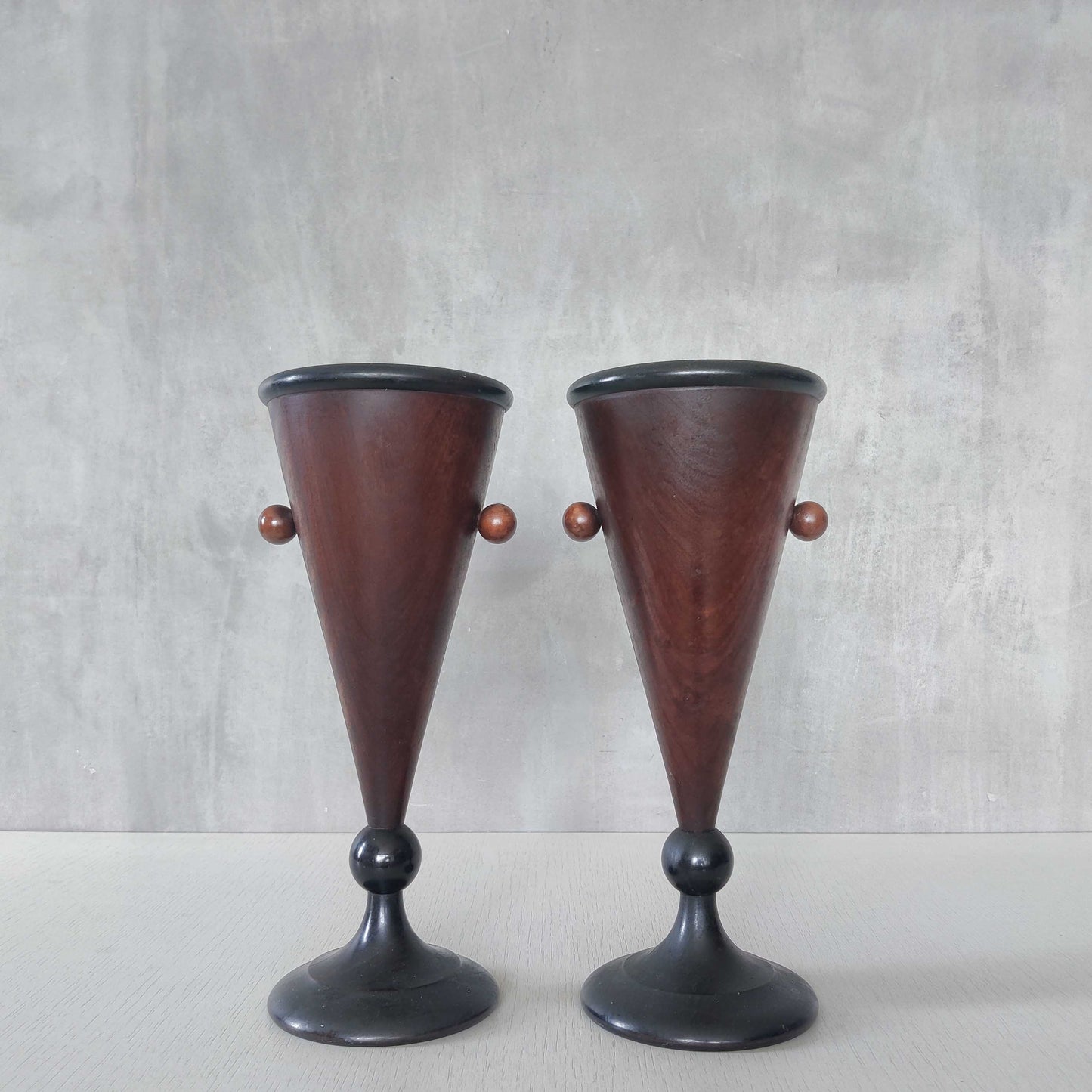 A pair of rosewood vases