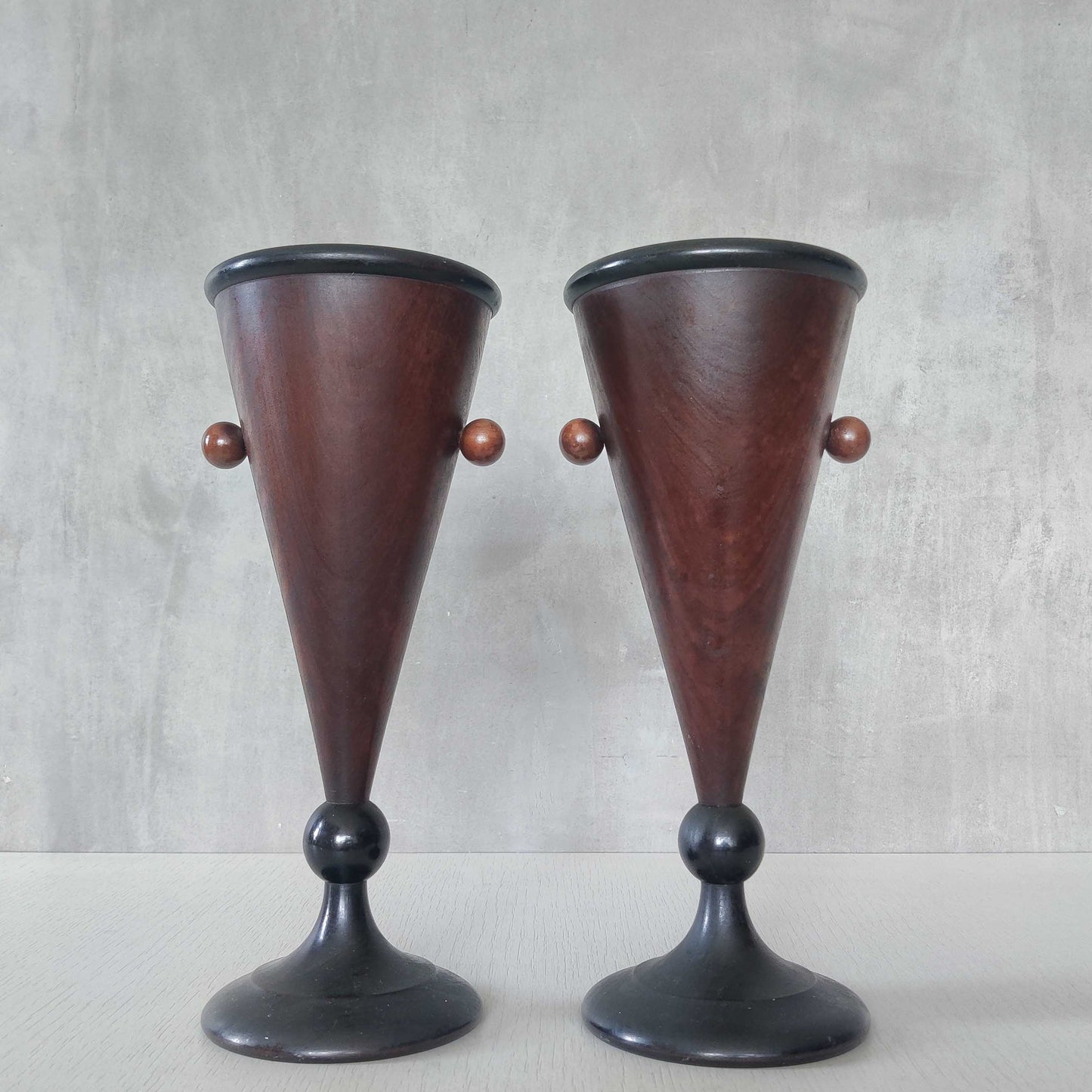A pair of rosewood vases