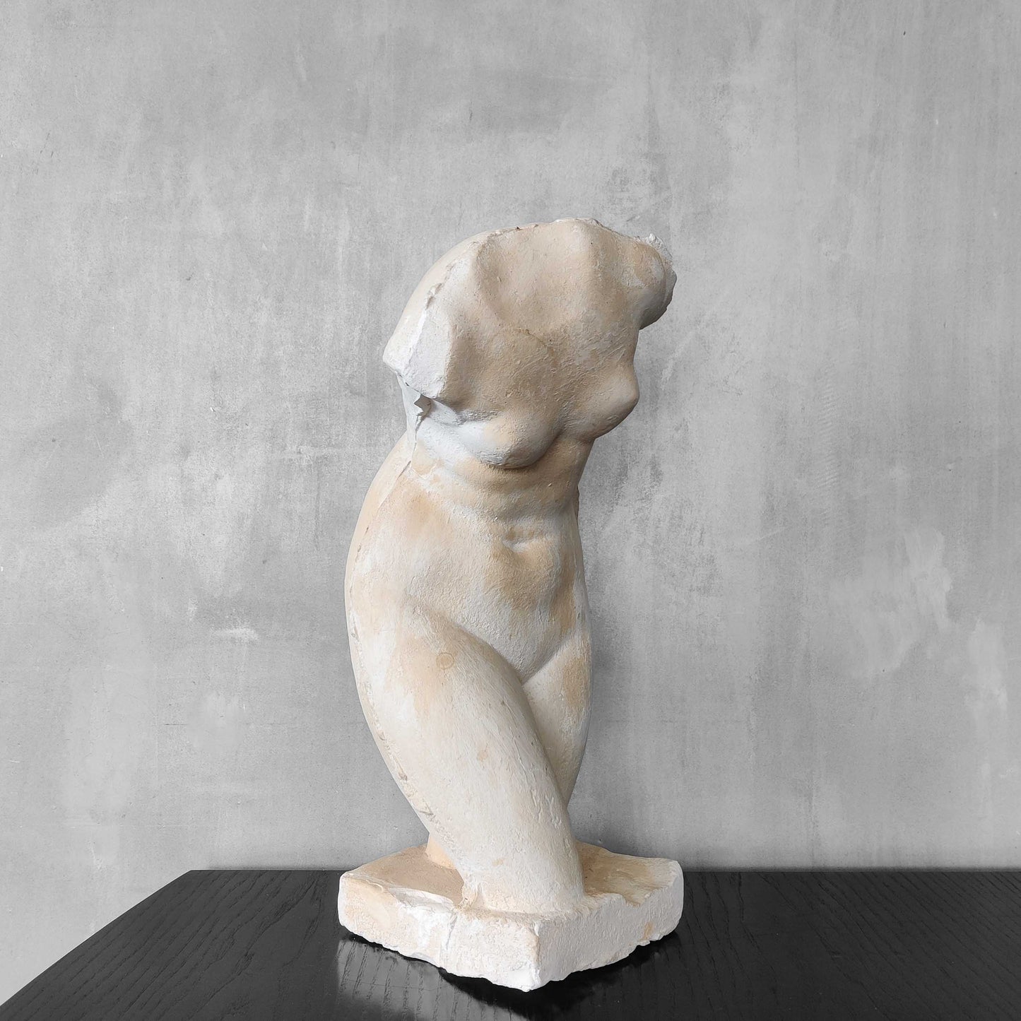 A large vintage studio plaster cast sculpture study of a female torso