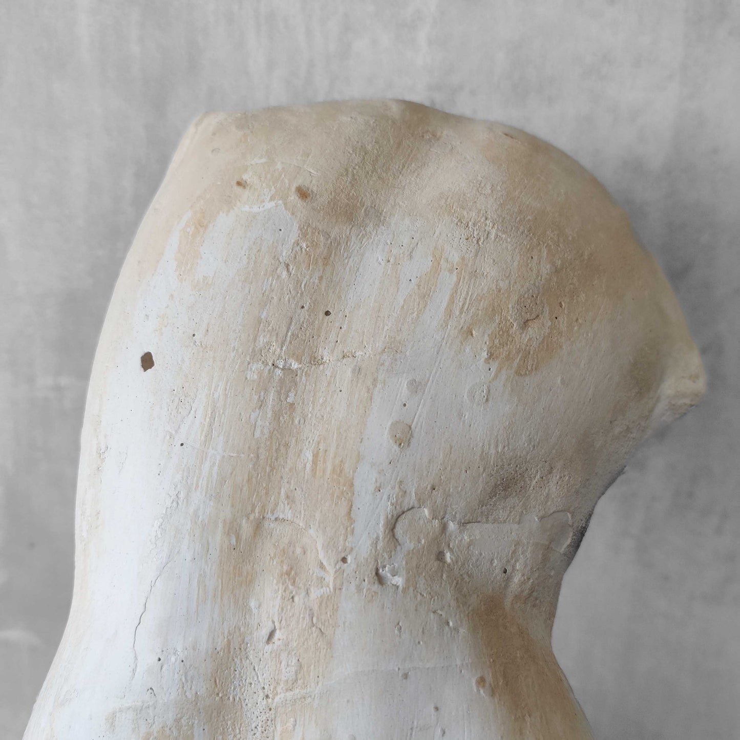 A large vintage studio plaster cast sculpture study of a female torso