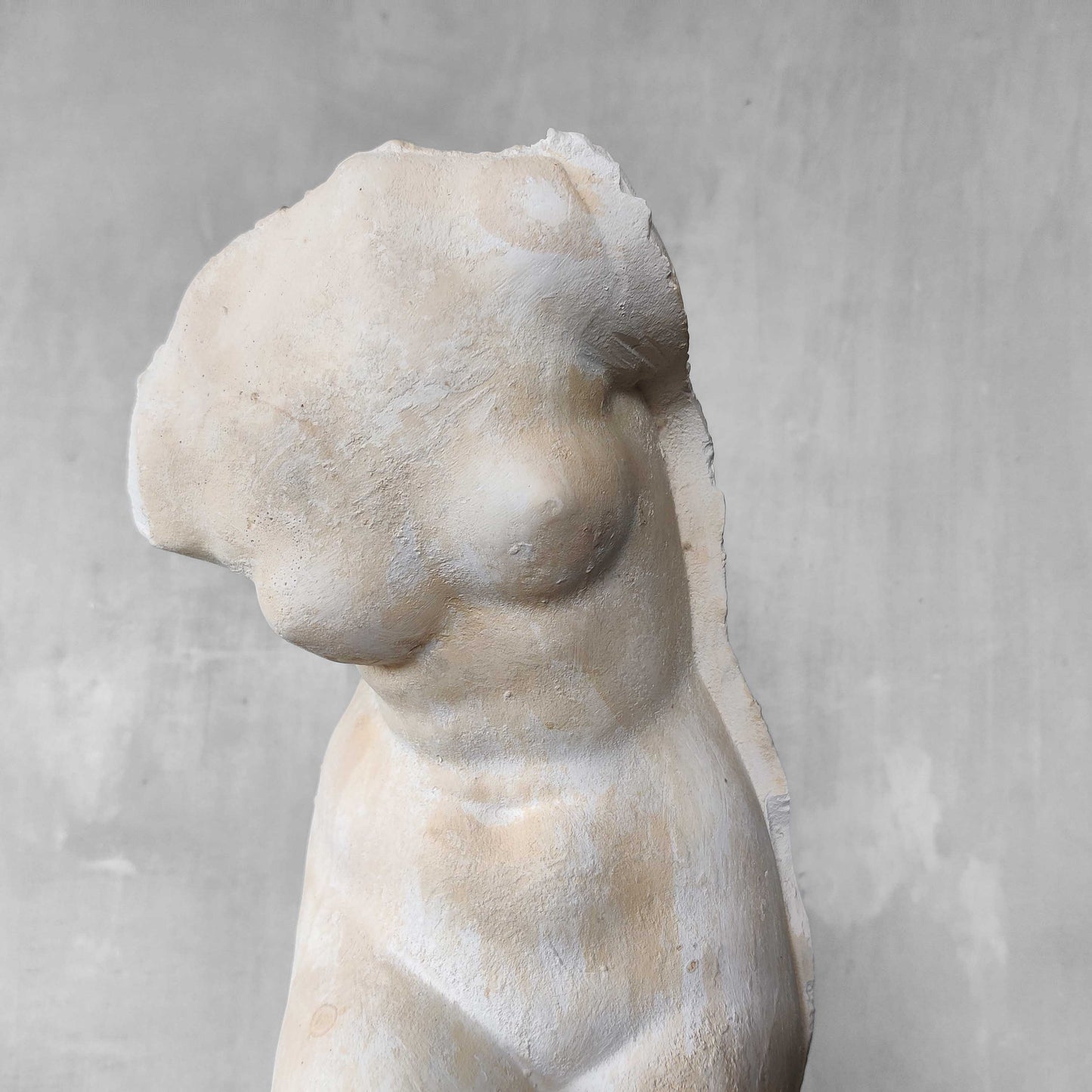 A large vintage studio plaster cast sculpture study of a female torso