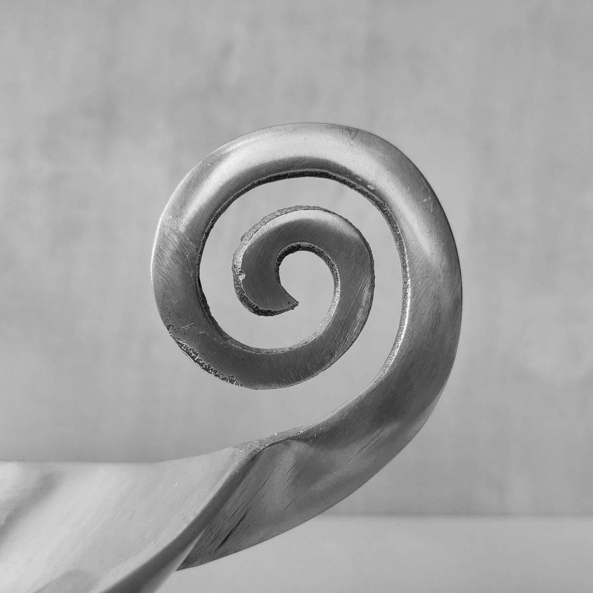 A 1990s cast aluminium centrepiece bowl with spiral handles