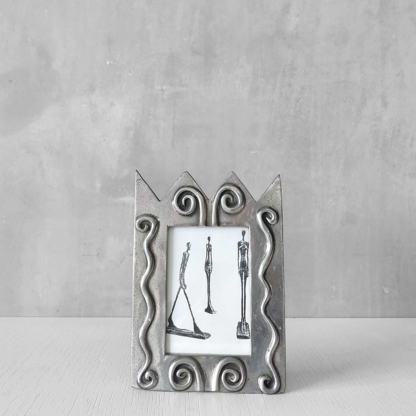 An early 1990s Carrol Boyes sculptural cast pewter photo frame with scroll reliefs