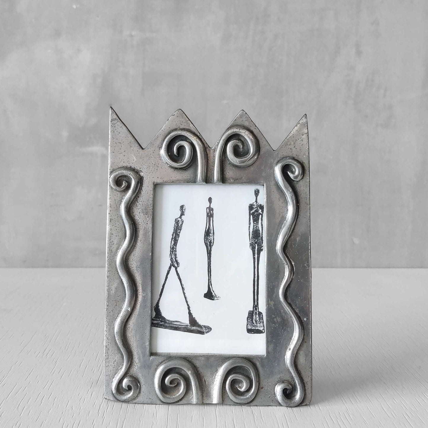 An early 1990s Carrol Boyes sculptural cast pewter photo frame with scroll reliefs