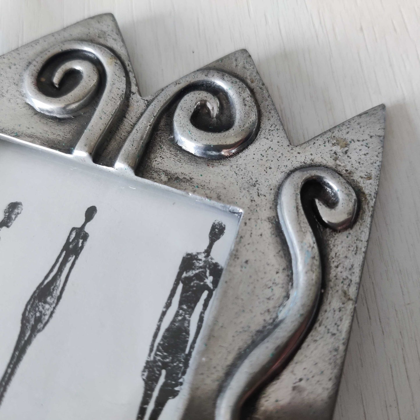 An early 1990s Carrol Boyes sculptural cast pewter photo frame with scroll reliefs