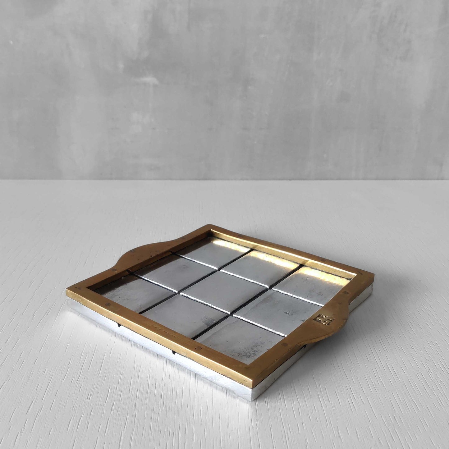Vintage David Marshall sand cast brass and aluminium small gridded tray