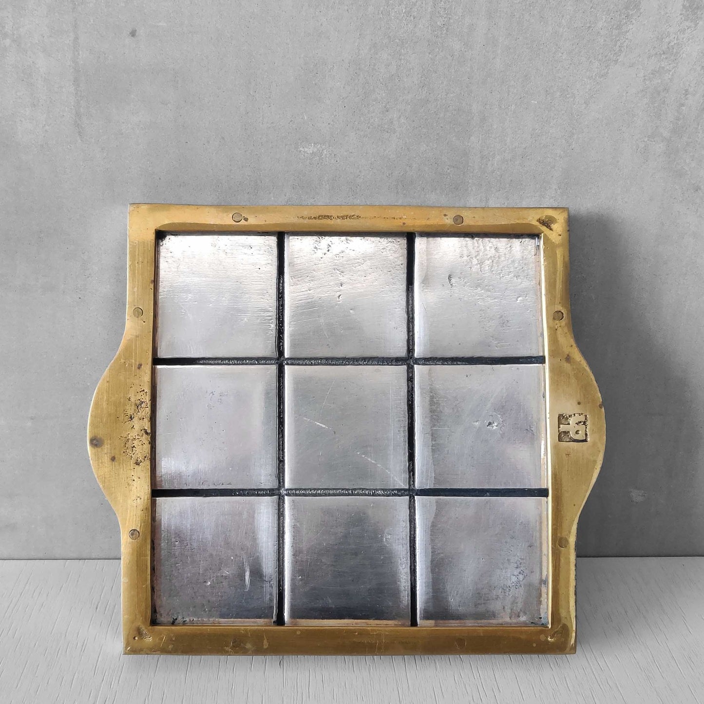 Vintage David Marshall sand cast brass and aluminium small gridded tray