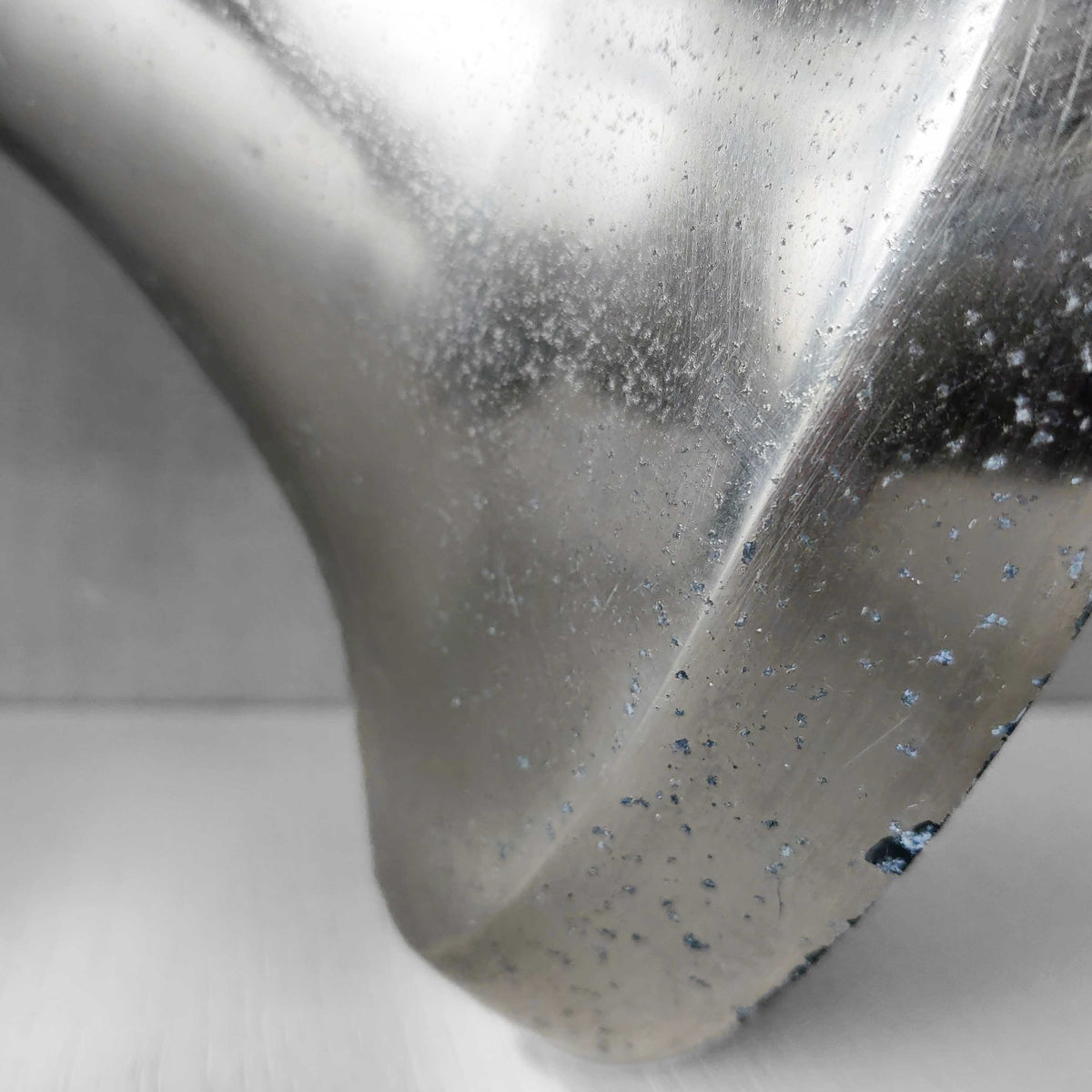 A vintage large cast aluminium sculptural urn profile vase