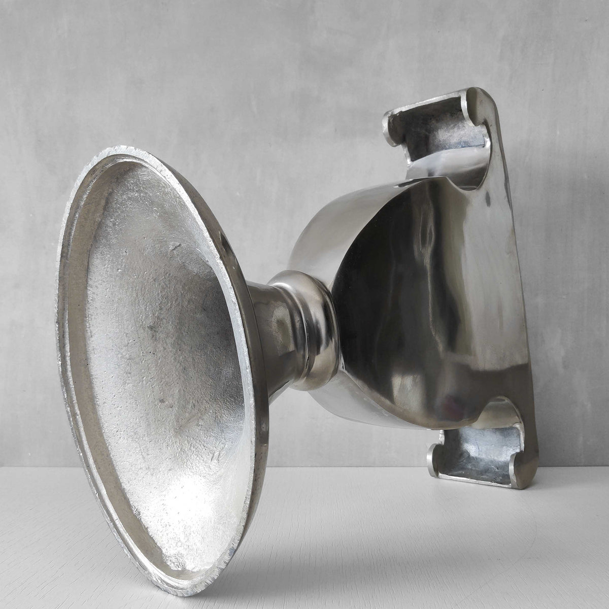 A vintage large cast aluminium sculptural urn profile vase