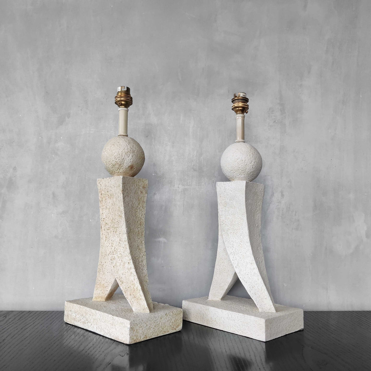 A pair of architectural sculptural postmodern table lamps