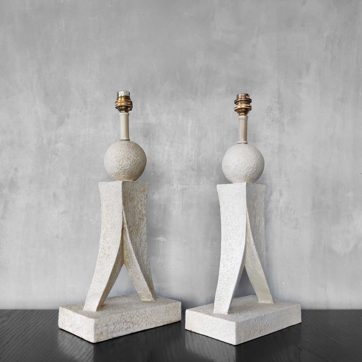 A pair of architectural sculptural postmodern table lamps
