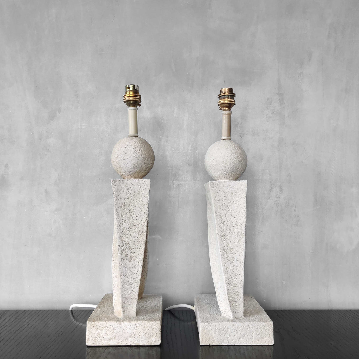 A pair of architectural sculptural postmodern table lamps