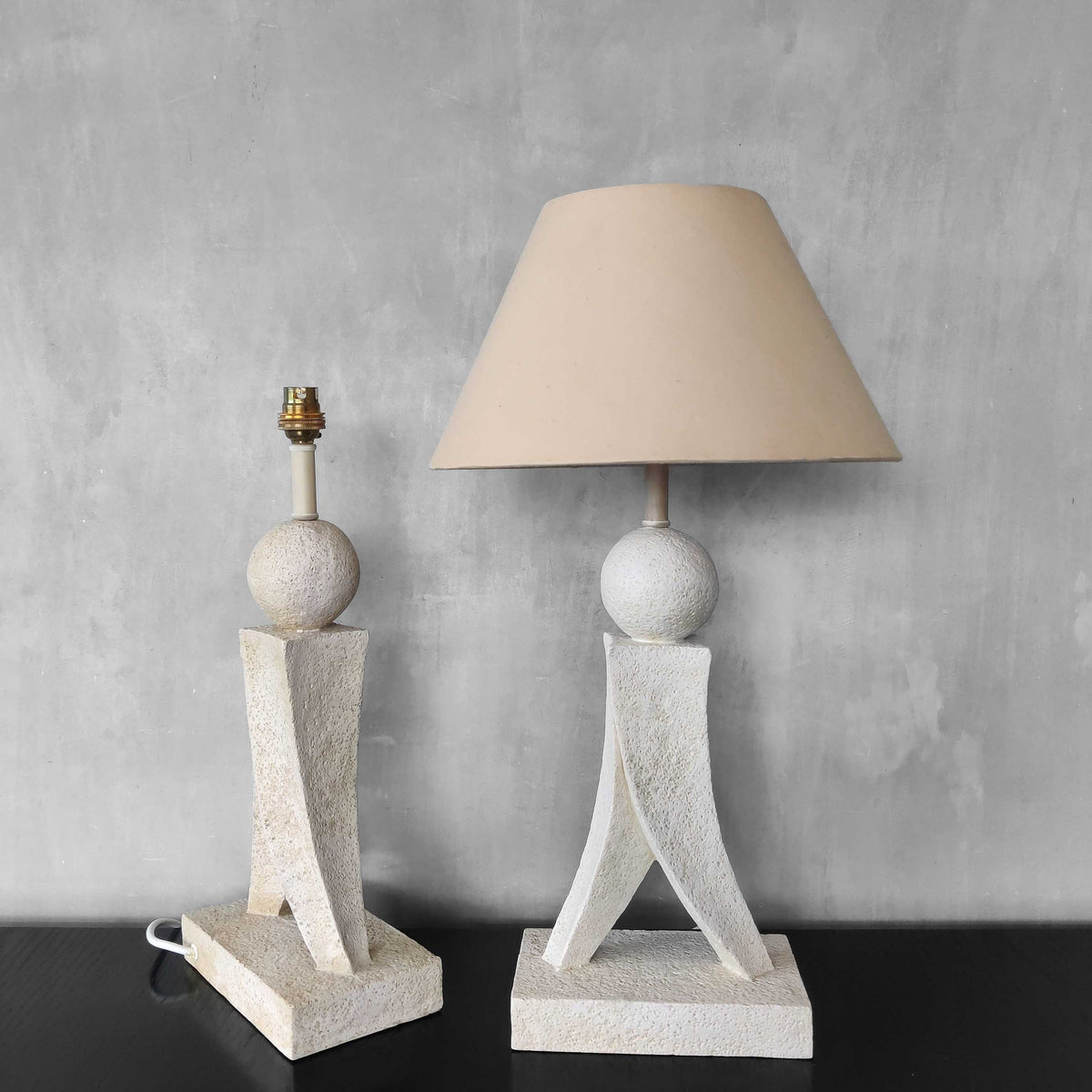 A pair of architectural sculptural postmodern table lamps