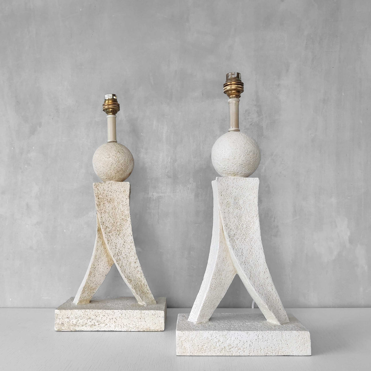 A pair of architectural sculptural postmodern table lamps