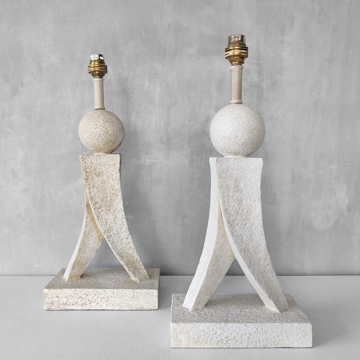 A pair of architectural sculptural postmodern table lamps