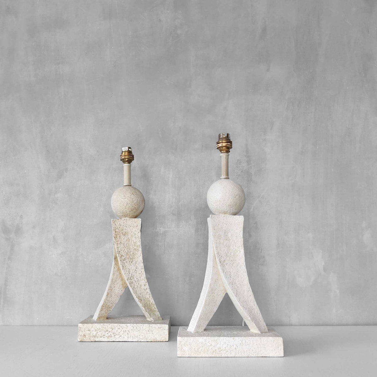 A pair of architectural sculptural postmodern table lamps