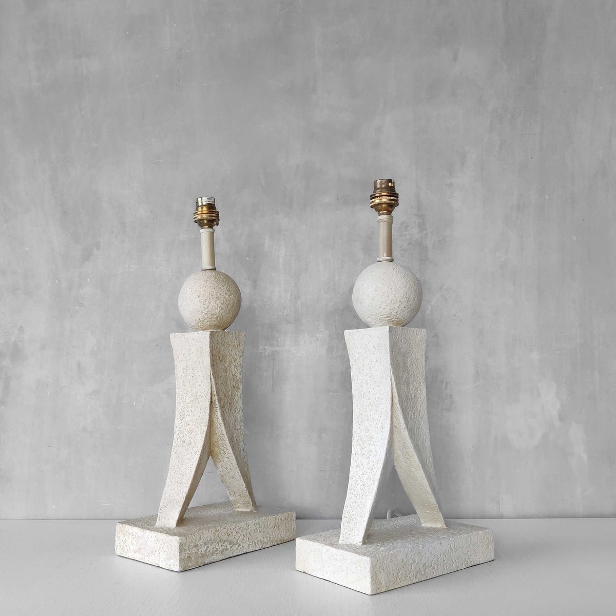 A pair of architectural sculptural postmodern table lamps