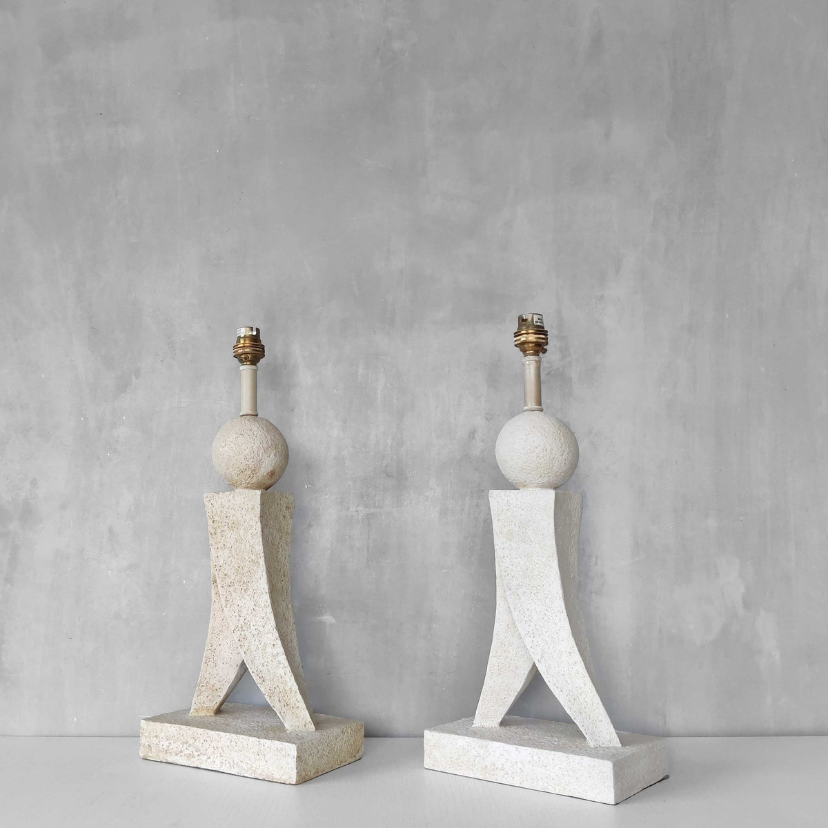 A pair of architectural sculptural postmodern table lamps