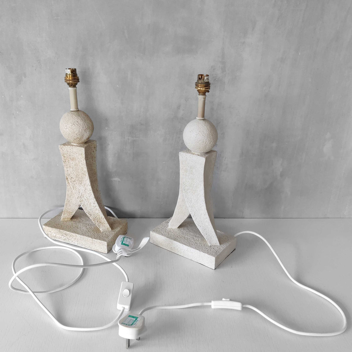 A pair of architectural sculptural postmodern table lamps