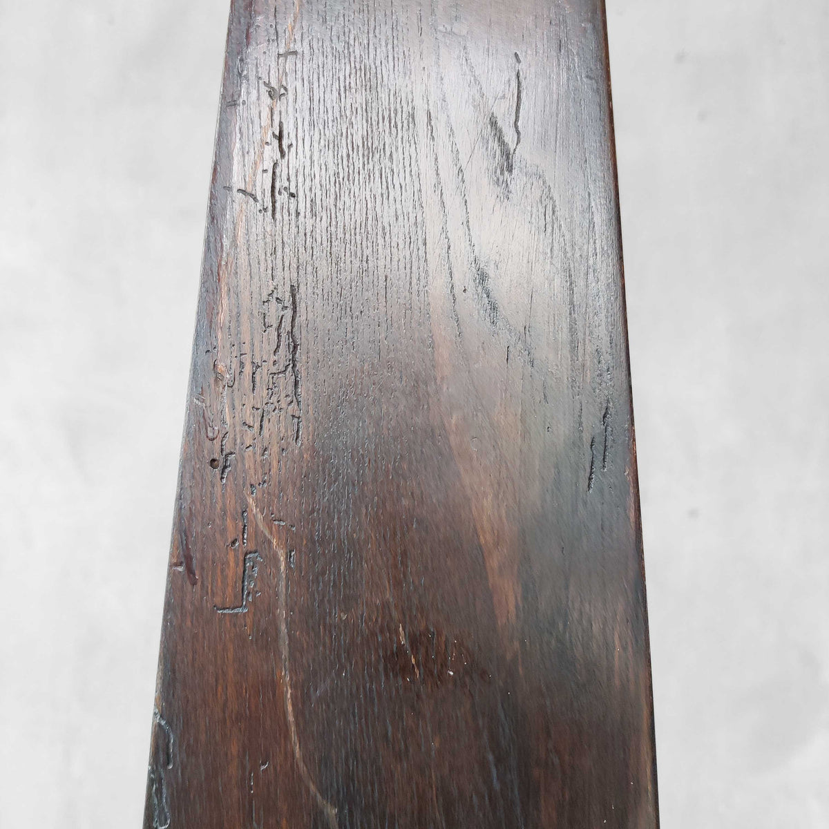 A pair of brutalist sculptural obelisk high back elm chairs